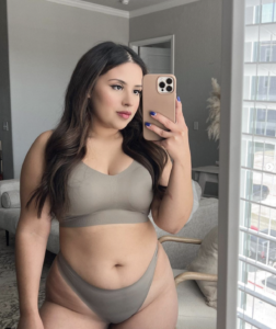 Laurynel Rivas talking a selfie in the mirror wearing EBY seamless underwear